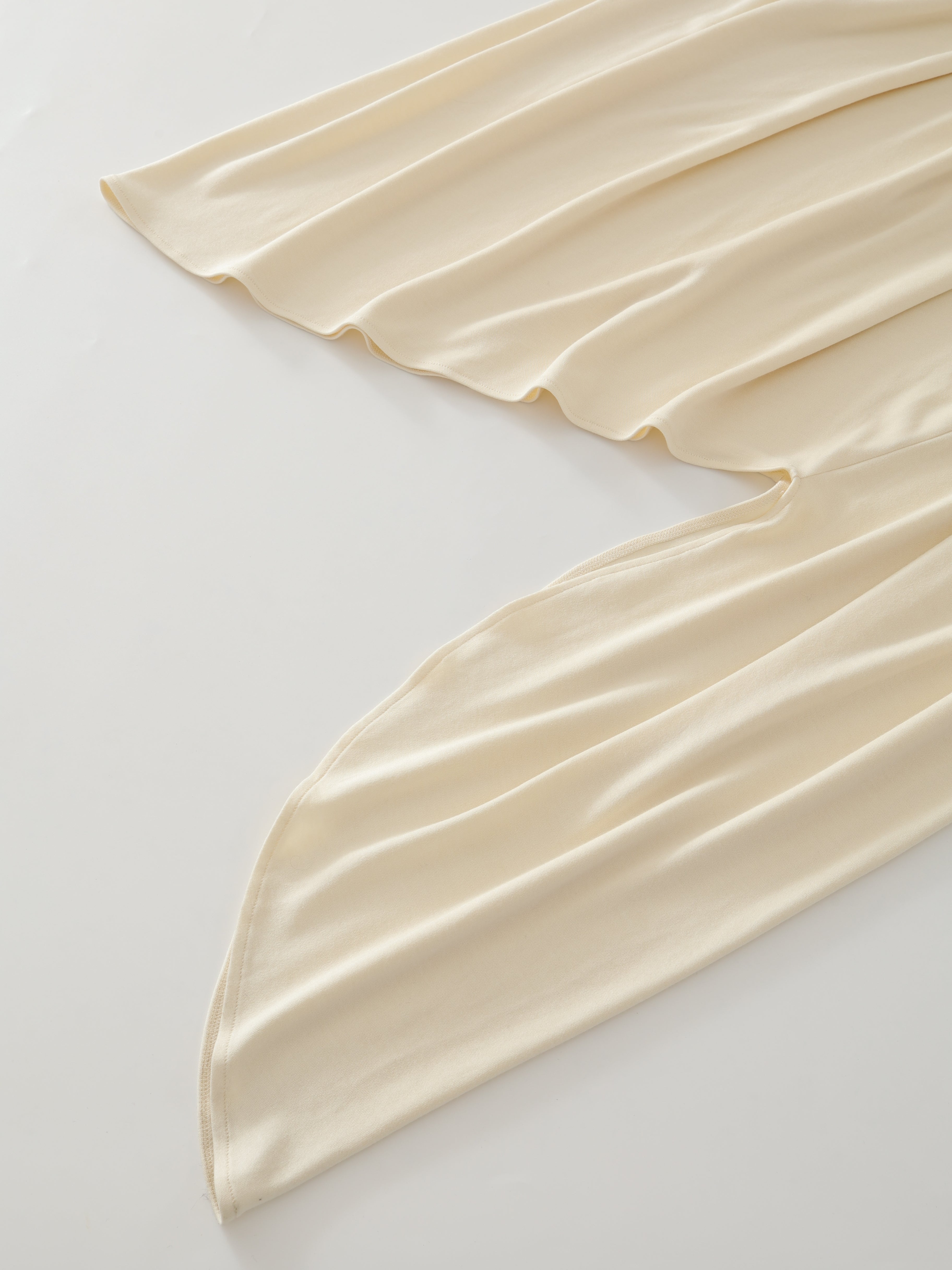 SS25 - Beveled asymmetrical pleated panelled skirt