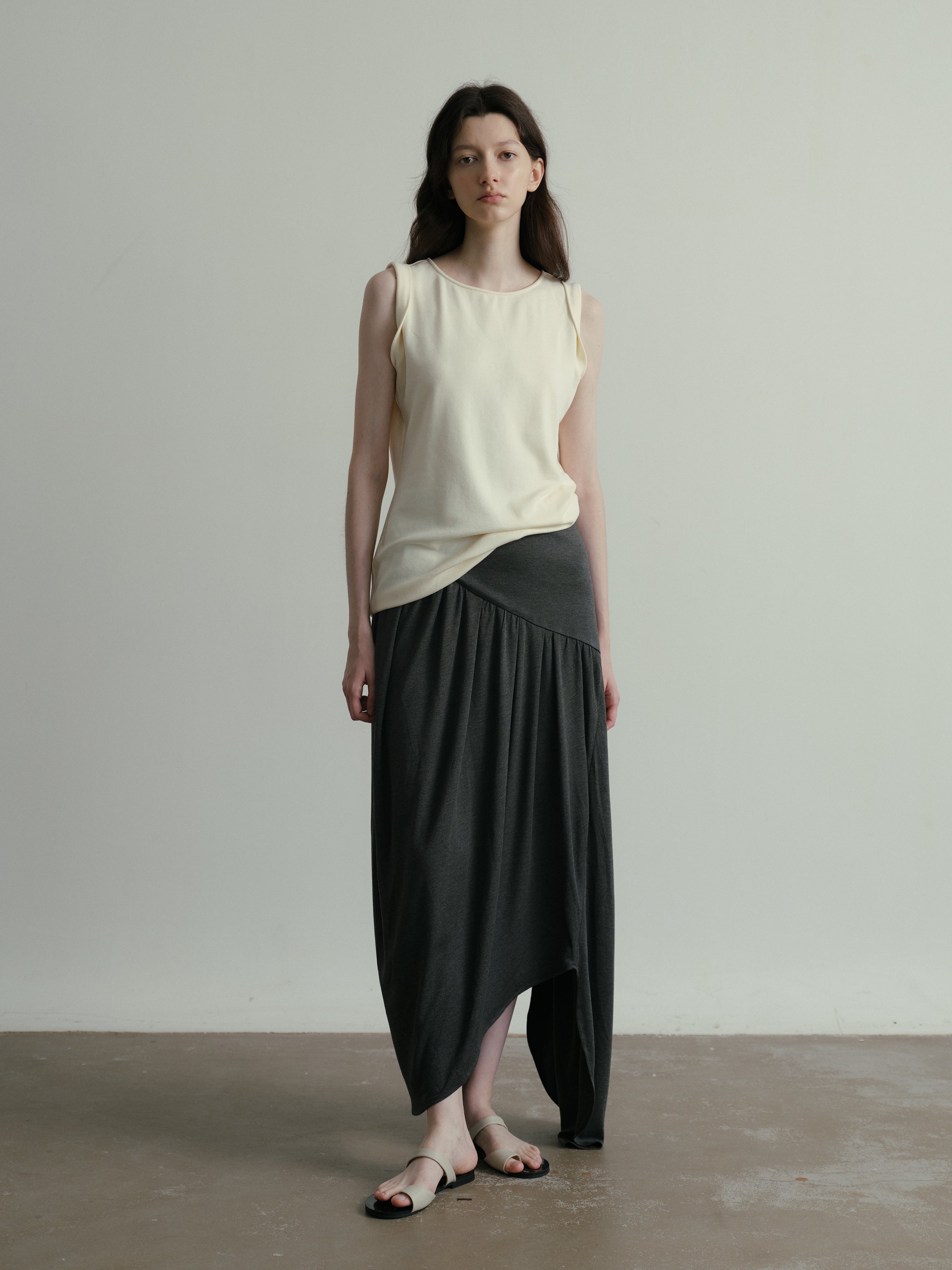 SS25 - Beveled asymmetrical pleated panelled skirt