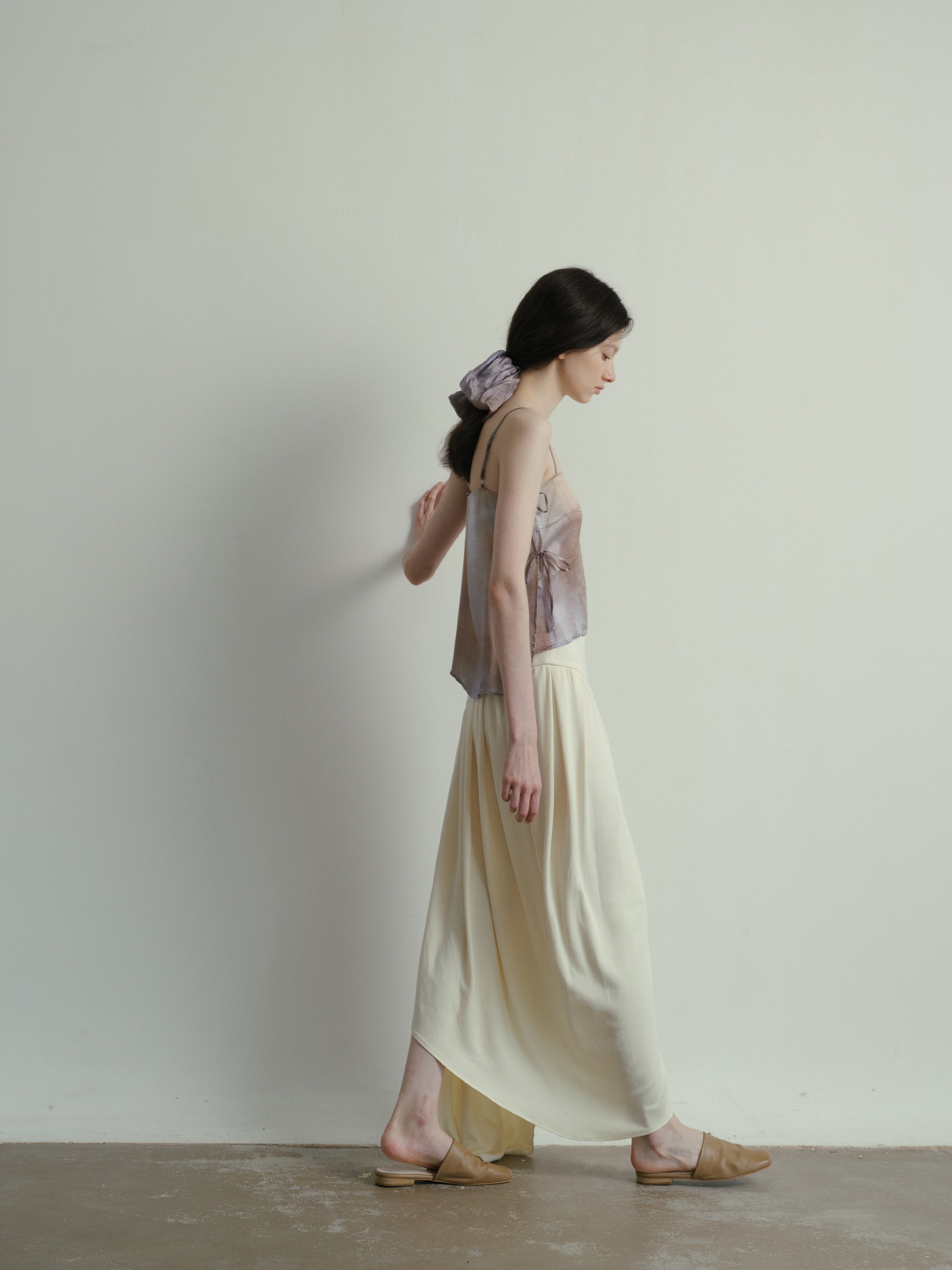 SS25 - Beveled asymmetrical pleated panelled skirt