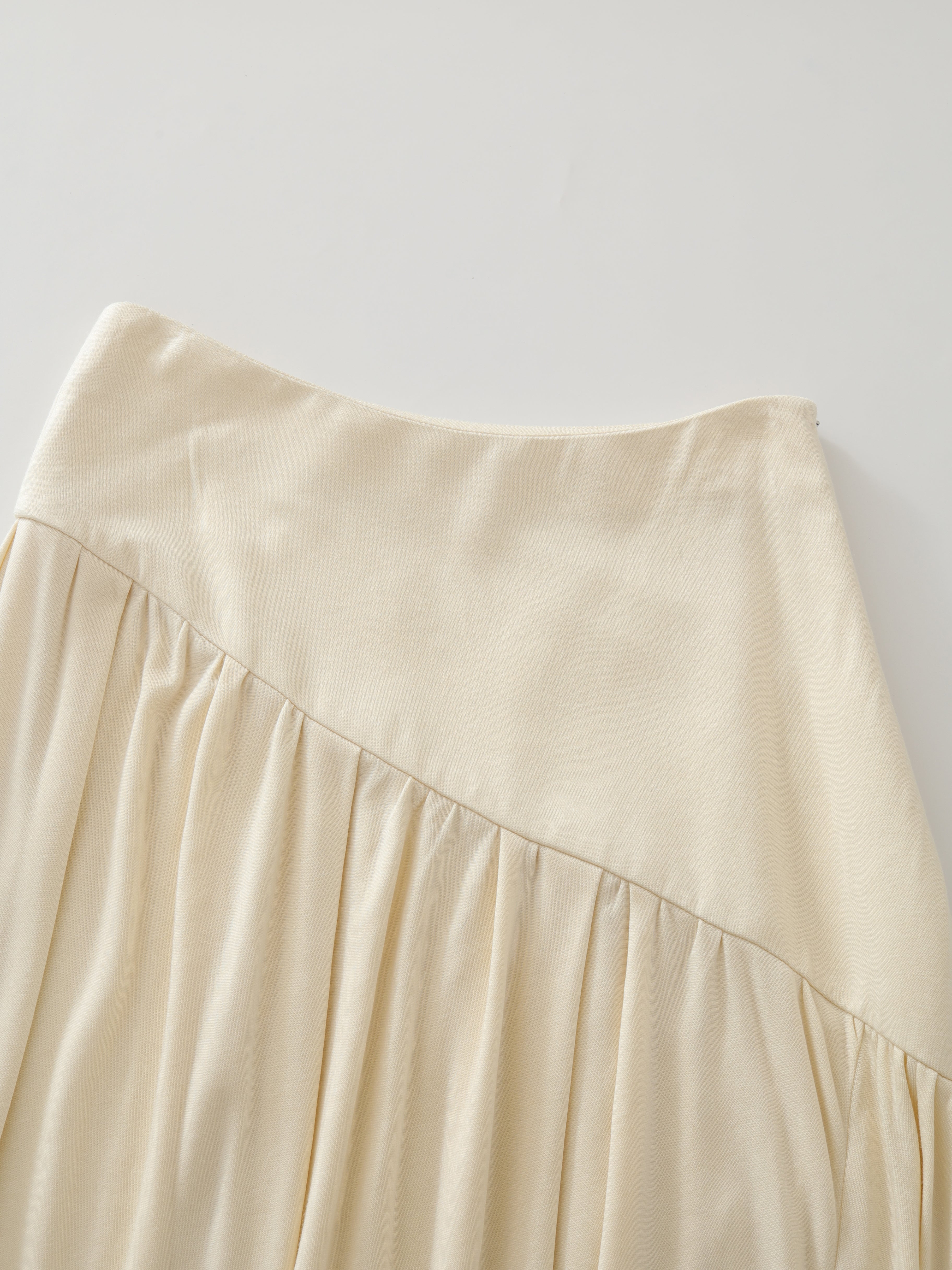 SS25 - Beveled asymmetrical pleated panelled skirt