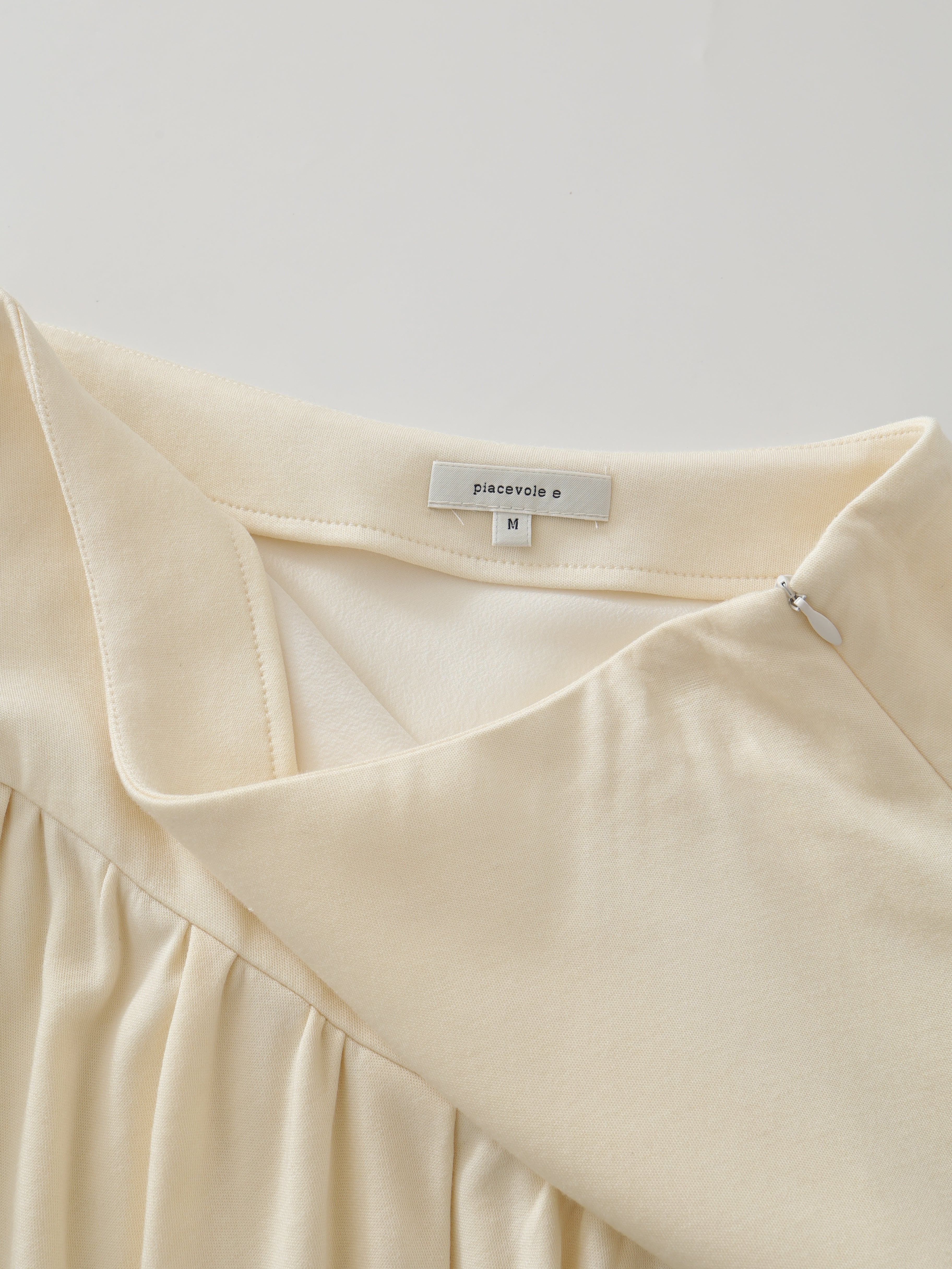 SS25 - Beveled asymmetrical pleated panelled skirt