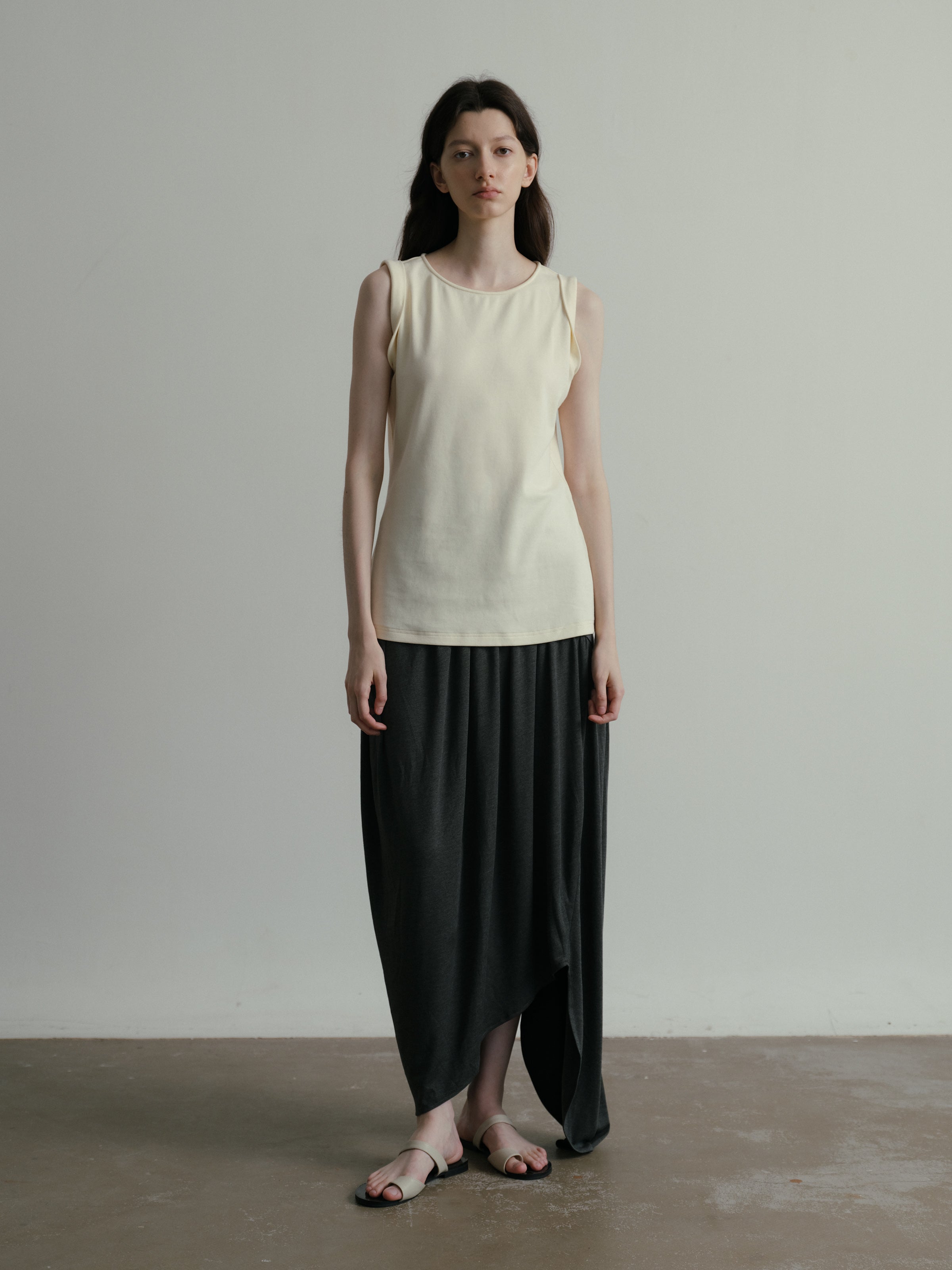 SS25 - Beveled asymmetrical pleated panelled skirt