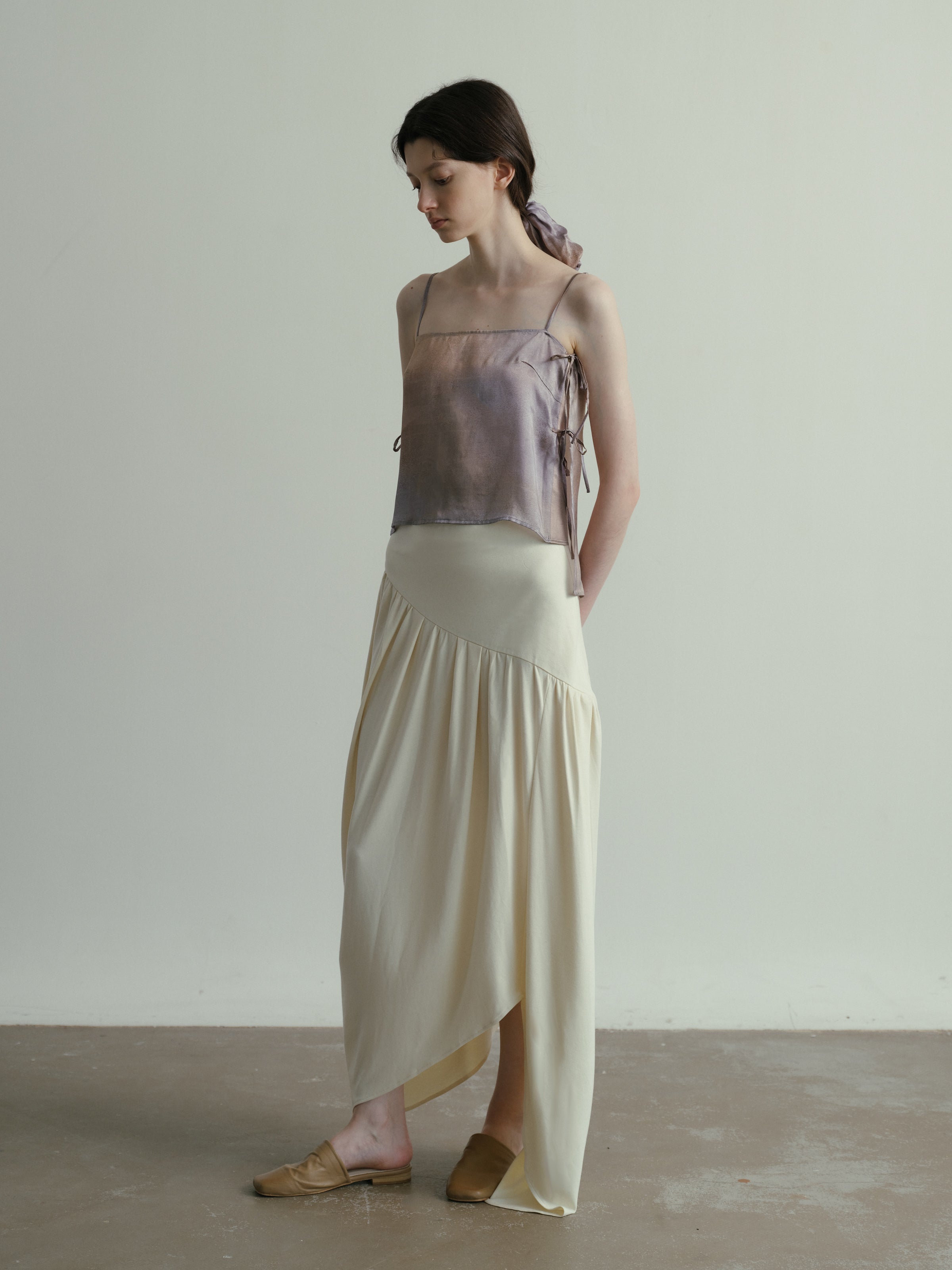 SS25 - Beveled asymmetrical pleated panelled skirt